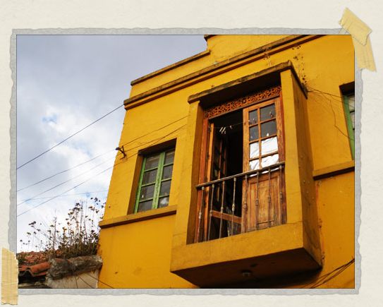 'In the Candeleria neighborhood, many of the colonial buildings were painted in bright yellows, blues, greens, and reds