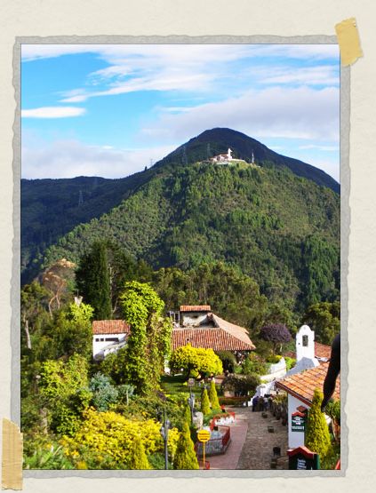 'On top of Monserrate: the city is to the right in this photo (not pictured), while the Fallen Christ (the patch of white showing up against the dark mountain) is in the background