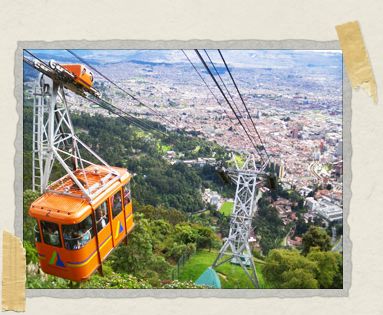 'A teleferico car makes its slow descent back down the mountain with visitors standing safely inside