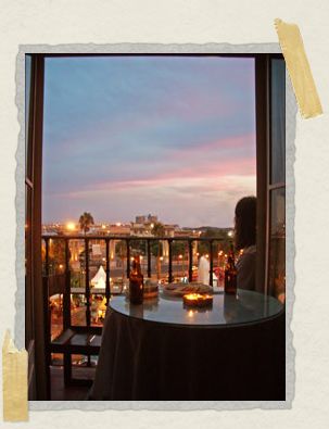 'From our balcony: the lights of the harbor and beyond them, the sea